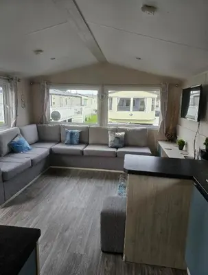 a living room with a couch and a table at Caravan to Hire - CalaGran Fleetwood Blackpool in Fleetwood