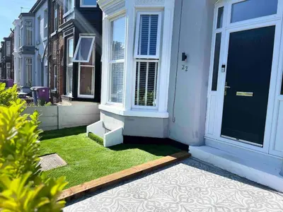 a front door of a house with green grass at Flat1 Large modern King Bed flat, private bedroom Ryan's place in Walton on the Hill