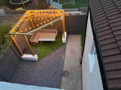 an overhead view of a patio with benches and lights at Flat3 large modern king Bed flat private bathroom ryan's place in Walton on the Hill
