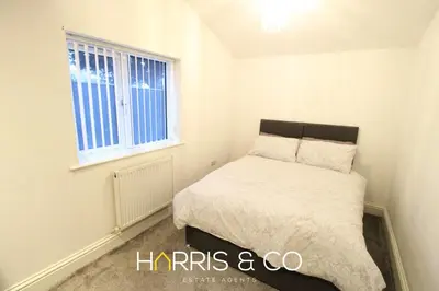 a small bedroom with a bed and a window at Fishermans Rest in Fleetwood