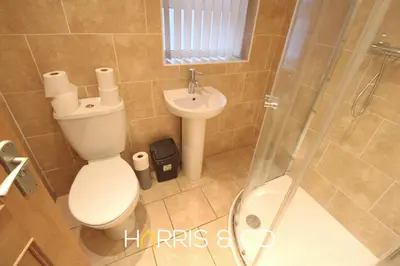 a bathroom with a toilet and a sink and a shower at Fishermans View in Fleetwood