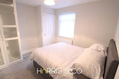 a bedroom with a bed and a window at Fishermans View in Fleetwood