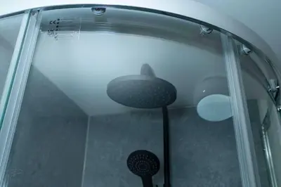a shower with a glass door with a lamp in it at Sleek Apartment in Blackpool, Beach View, WiFi, Sleeps 6 in Blackpool