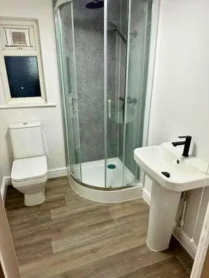a bathroom with a shower and a toilet and a sink at Sleek Apartment in Blackpool, Beach View, WiFi, Sleeps 6 in Blackpool