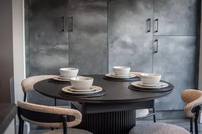 a table with four cups on it with chairs at Modern 3-Bed Home-Liverpool Stay in Sefton