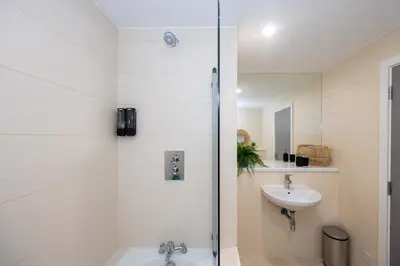 a bathroom with a shower and a sink at Stunning Liverpool Dockside Apt by City SuperHost in Liverpool