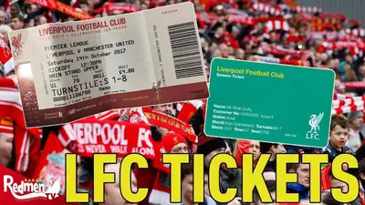 a sign in front of a crowd at a football game at Stunning Liverpool Dockside Apt by City SuperHost in Liverpool