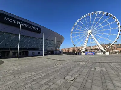 a large ferris wheel in front of a stadium at Stunning Liverpool Dockside Apt by City SuperHost in Liverpool