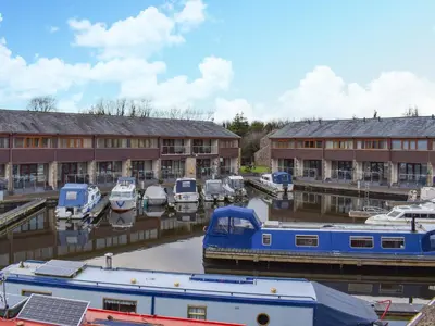a group of boats are docked in a marina at Sailing By in Carnforth