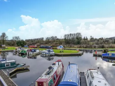 a group of boats docked at a marina at Sailing By in Carnforth