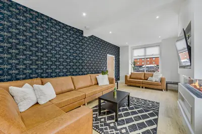 a living room with a couch and a table at Lund House in Ulverston