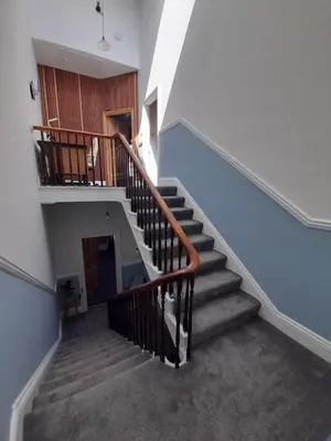 a staircase in a building with a stair case at Comfortable family home with amazing Seaviews in Fleetwood