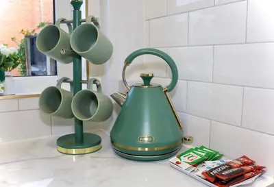 a green tea kettle on a counter in a kitchen at Cosy 2-Bed Home Near St Helens Centre - Free WiFi in Saint Helens