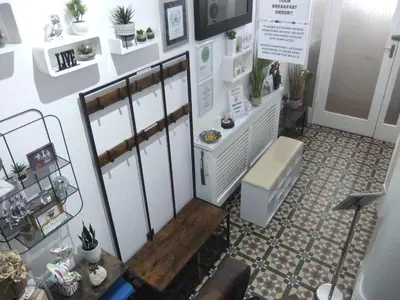 a room with white walls and plants on the wall at FourRooms - Couples Only in Blackpool