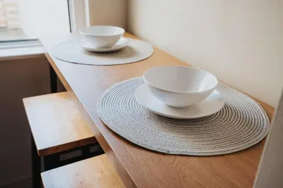 two bowls and plates on a counter in a kitchen at Charlottes Place in Liverpool