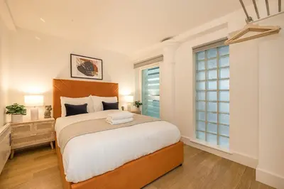 a bedroom with a large bed and a window at Liverpool City Centre Apartment in Liverpool