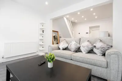 a living room with a couch and a coffee table at Beautiful House - Free Parking - 5 mins to centre in Liverpool