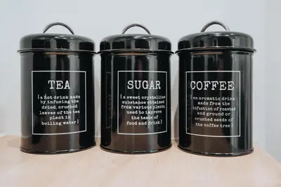a group of three black thermosutes sitting on a shelf at Beautiful House - Free Parking - 5 mins to centre in Liverpool