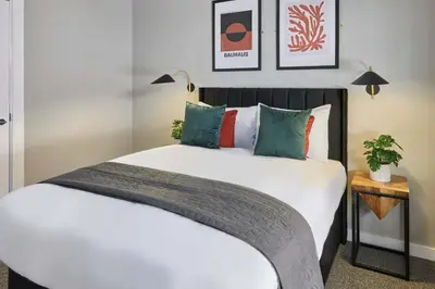 a bedroom with a large white bed with pillows at Ropewalks Retreat III - Sleeping 8 Guests with Parking in Liverpool