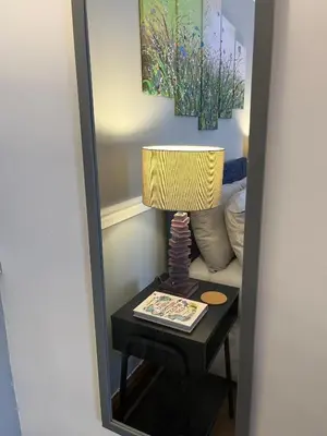 a mirror with a lamp on a table at Modern 4-bed stay-away-home sleeps 8 in Preston in Preston