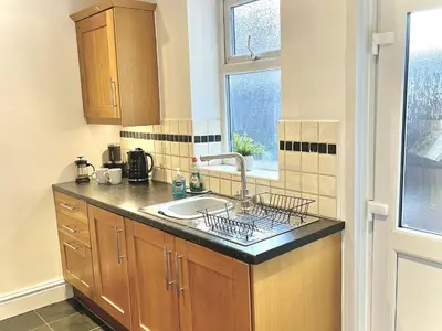 a kitchen with a sink and a window at Modern 4-bed stay-away-home sleeps 8 in Preston in Preston