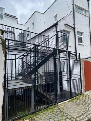a metal staircase in front of a building at Clock Tower Apartments No2 in Morecambe
