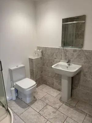 a bathroom with a toilet and a sink at Modern, sleeps 5, parking, semi rural, Upholland in Upholland