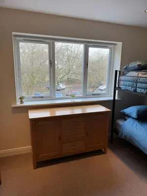 a bedroom with a desk in front of a window at Modern, sleeps 5, parking, semi rural, Upholland in Upholland