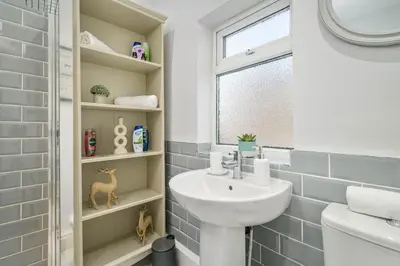 a bathroom with a sink and a toilet at Liverpool 3 Bedroom Contractor Stay Cherry House in Liverpool