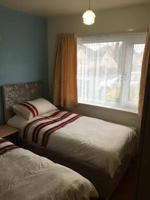 two beds in a room with a window at Book 3 or more nights get one night free !!! in Bare