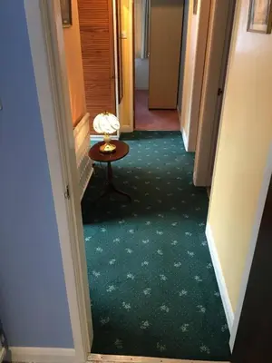 a hallway with a table in the middle of a room at Book 3 or more nights get one night free !!! in Bare