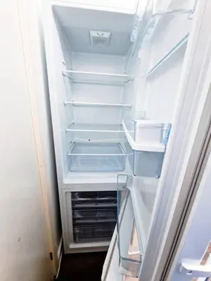 an empty refrigerator with its door open and its shelves at Beautiful home near LFC Stadium in Liverpool