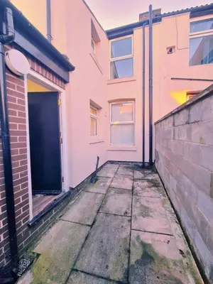 an empty sidewalk in front of a building at Beautiful home near LFC Stadium in Liverpool