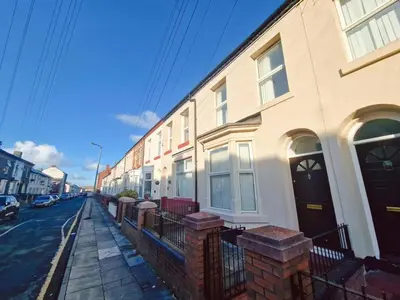 a row of houses on a city street at Beautiful home near LFC Stadium in Liverpool