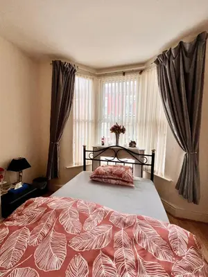 a bedroom with a large bed in front of a window at Anfield Goodison Stanley Park Liverpool in Liverpool