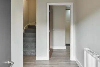 a hallway with a stairway with a door leading to a room at Host & Stay - Chic Townhouse by the Docks in Liverpool