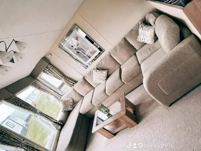 an overhead view of a living room with a couch at Metcalfes family caravan in Heysham