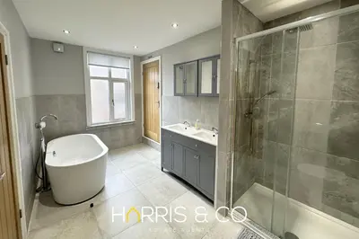 a bathroom with a tub and a sink and a shower at Admirals Rest in Fleetwood