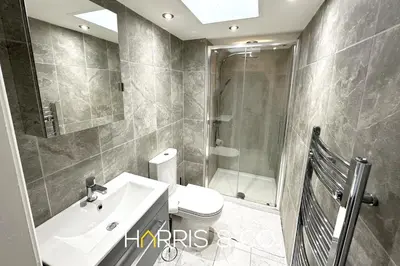 a bathroom with a sink and a toilet and a shower at Admirals Rest in Fleetwood