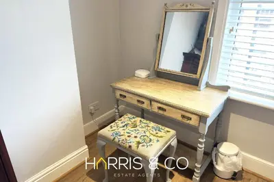 a dressing table with a mirror and a stool at Admirals Rest in Fleetwood