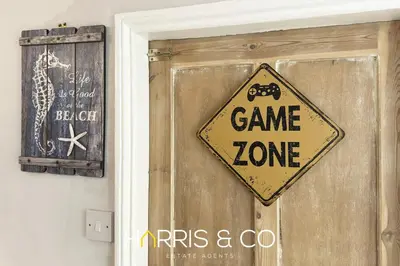 a sign on a door that says game zone at Admirals Rest in Fleetwood