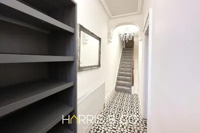 a hallway with a black and white tiled floor at Admirals Rest in Fleetwood