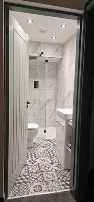 a bathroom with a shower and a toilet and a sink at Weavers Cottage Whalley in Whalley