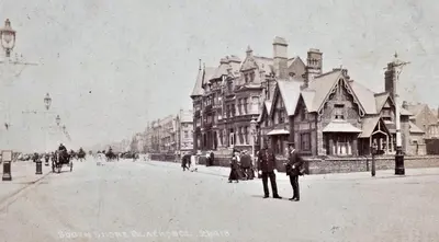 an old black and white photo of a street with buildings at The Sands Hotel in Blackpool