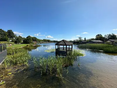a small gazebo in the middle of a river at Lakeside 18 in Carnforth