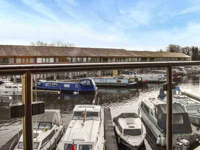 a group of boats docked at a marina at Marina Haven in Carnforth