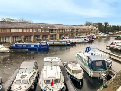 a group of boats are docked in a marina at Marina Haven in Carnforth