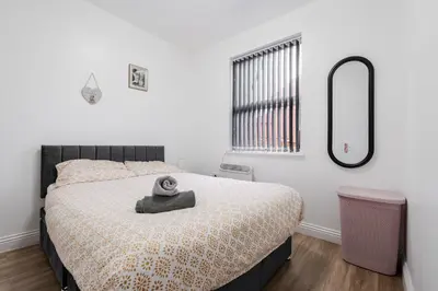 a bedroom with a bed with a mirror on it at Roof Terrace WM Smart TV Free Parking in Liverpool