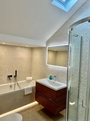 a bathroom with a tub and a sink and a shower at Olive Lodge Lytham in Lytham St Annes