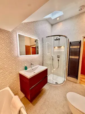a bathroom with a sink and a shower at Olive Lodge Lytham in Lytham St Annes